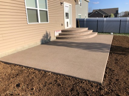 Sand Matrix stamped concrete with Autumn Oak integral and cantilever steps in Westfield Indiana – Indy Decorative Concrete