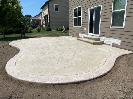 Appalachian Flagstone stamped concrete with Lanon Stone integral, Smoke release, Smoke hardener border and wedding cake cantilever steps in Indianapolis Indiana – Indy Decorative Concrete