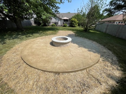 Appalachian Flagstone stamped concrete with Wheat integral, Colina Tan release and wood-burning fire pit with custom cap in Indianapolis Indiana – Indy Decorative Concrete