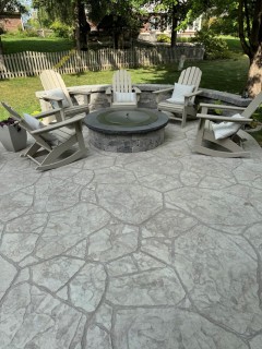 Appalachian Flagstone stamped concrete with Pewter integral, Smoke release and seat wall with smokeless insert wood-burning fire pit in Carmel Indiana – Indy Decorative Concrete