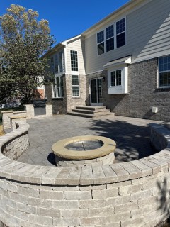 English Rivenstone stamped concrete with Autumn Oak integral, Storm Gray release and seat wall and gas fire pit with custom top caps in Carmel Indiana – Indy Decorative Concrete