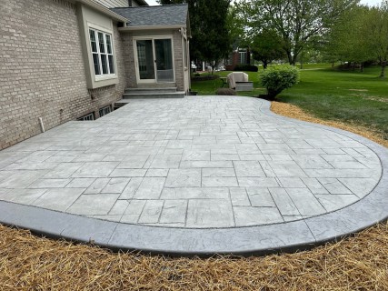 Majestic Ashlar Slate stamped concrete with Pewter integral, Cape Cod Gray release, Cape Cod Gray hardener and cantilever steps in Carmel Indiana – Indy Decorative Concrete