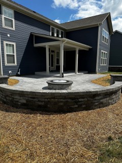 Majestic Ashlar Slate stamped concrete with Pewter integral, Storm Gray release, Cape Cod Gray hardener border, smokeless fire pit and columns with custom top cap in Hamilton County Indiana – Indy Decorative Concrete