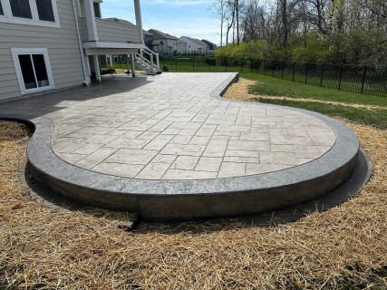 Majestic Ashlar Slate stamped concrete with Smoke integral, Storm Gray release and Storm Gray hardener border in Westfield Indiana – Indy Decorative Concrete