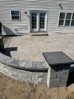 Orchard Stone - Autumn Oak Integral - Storm Gray Release - Storm Gray Border - Stone Liner Step - Gray Block Seat Wall and Columns with Dark Gray Top Caps