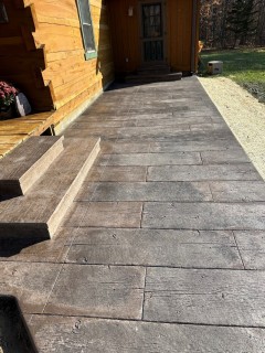 Gilpin's 16-inch wood plank stamped concrete with Mocha Brown integral, Charcoal release and wedding cake cantilever steps in Morgantown – Indy Decorative Concrete