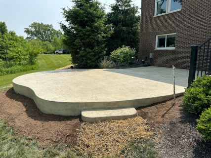 Hadley Creek stamped concrete with Bone hardener, Smoke release, and rubbed step in Westfield Indiana – Indy Decorative Concrete