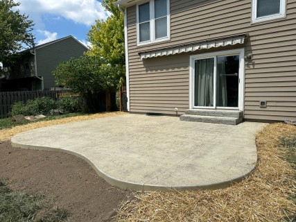Hadley Creek stamped concrete with Bone hardener, Smoke release, and stone liner steps in Fishers Indiana – Indy Decorative Concrete