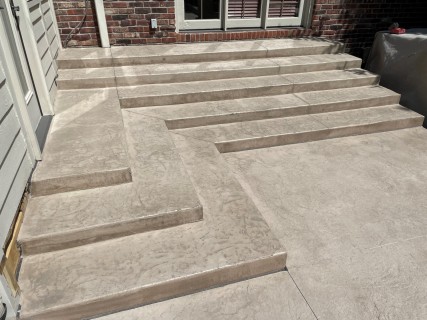 Hadley Creek stamped concrete with stacked steps, Smoke integral color and Smoke release in Carmel Indiana – Indy Decorative Concrete