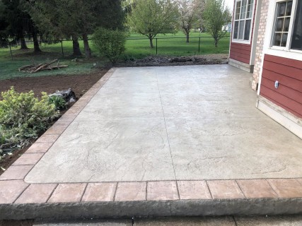Heavy Stone stamped concrete with Lanon Stone integral, Smoke release and Colina Tan hardener tooled and scored border in Indiana – Indy Decorative Concrete