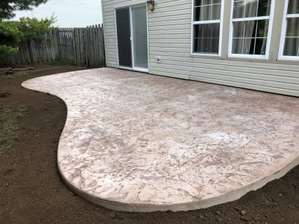 Oxford Slate stamped concrete with French Cream hardener and Walnut release in Avon Indiana – Indy Decorative Concrete