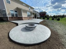 PEWTER-integral-color-Stamp-with-HEAVY-STONE-stamp-with-STORM-GRAY-release-RUBBED-step-down-to-firepit-Install-ROUND-WOOD-firepit-with-GRAY-block-and-DARK-GRAY-top-cap-4