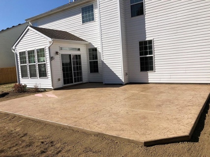 Oxford Slate stamped concrete with Harvest Wheat integral and Walnut release in McCordsville Indiana – Indy Decorative Concrete
